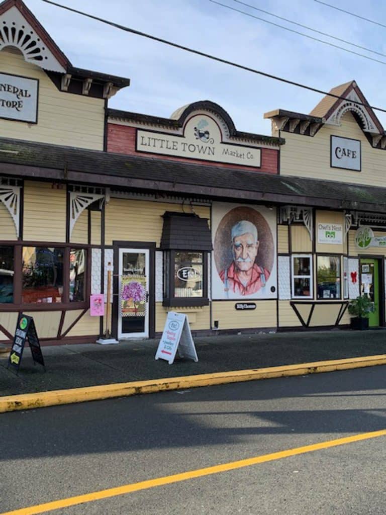 Colorful storefronts with signage and decor.