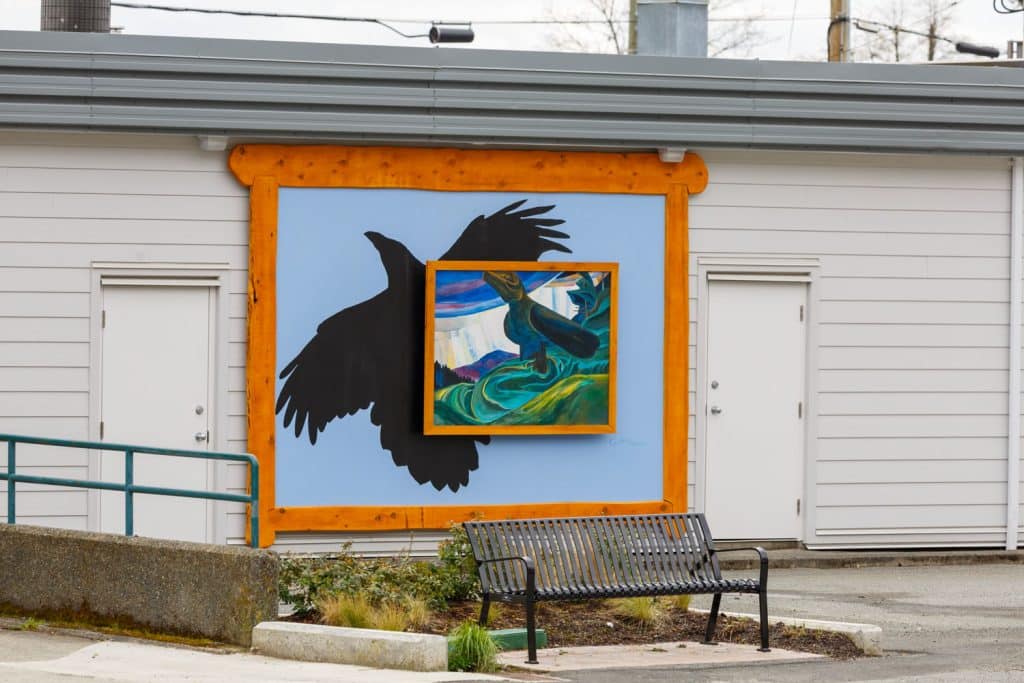 Mural of a crow and painting