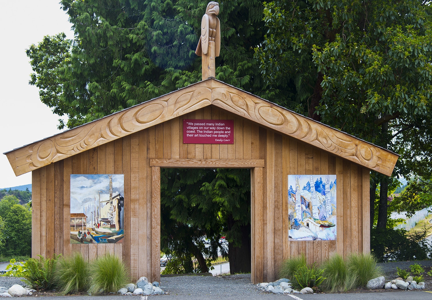 Wooden structure with Indigenous artwork displayed.