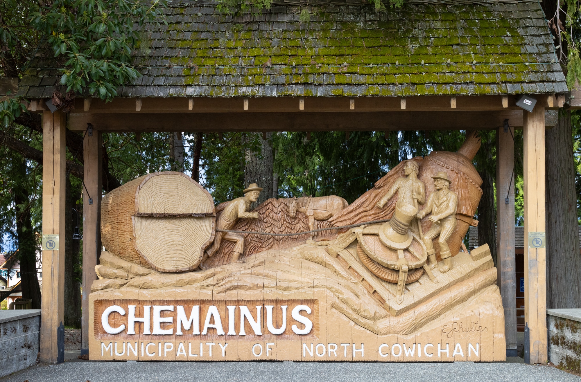 Wooden sculpture depicting local history.