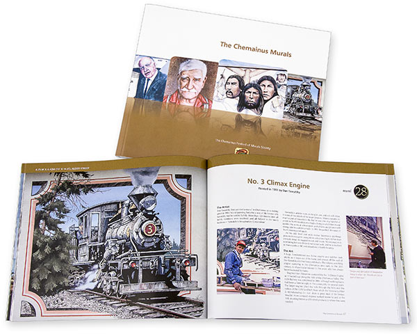Book featuring Chemanius murals and trains.